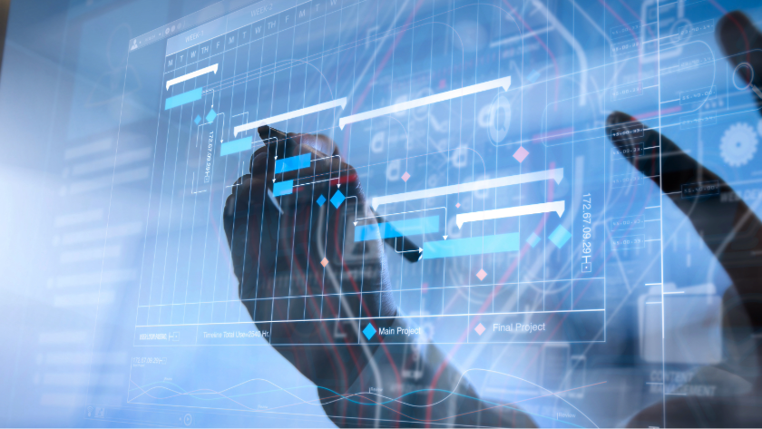 Hand markerar på digital Gantt-schema med projektplan och tidslinje på skärm.