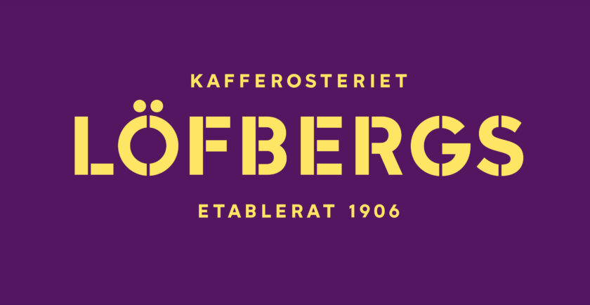 Gul text på lila bakgrund: "Kafferosteriet Löfbergs Etablerat 1906".